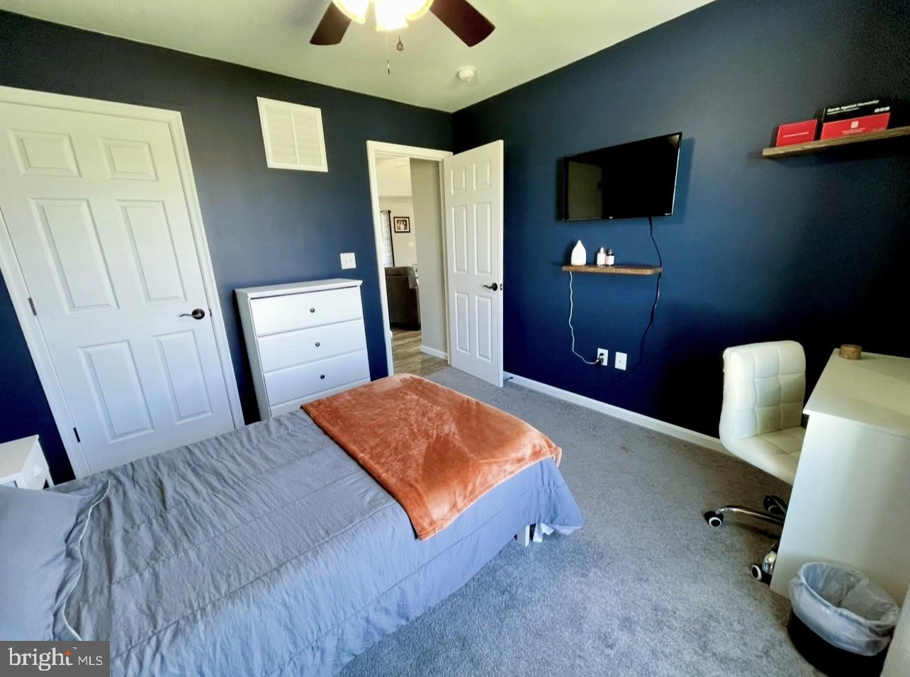 29389 Eagle Point Drive Seaford, DE 19973 - Photo 36 of 42 a bedroom with a bed and a flat screen tv