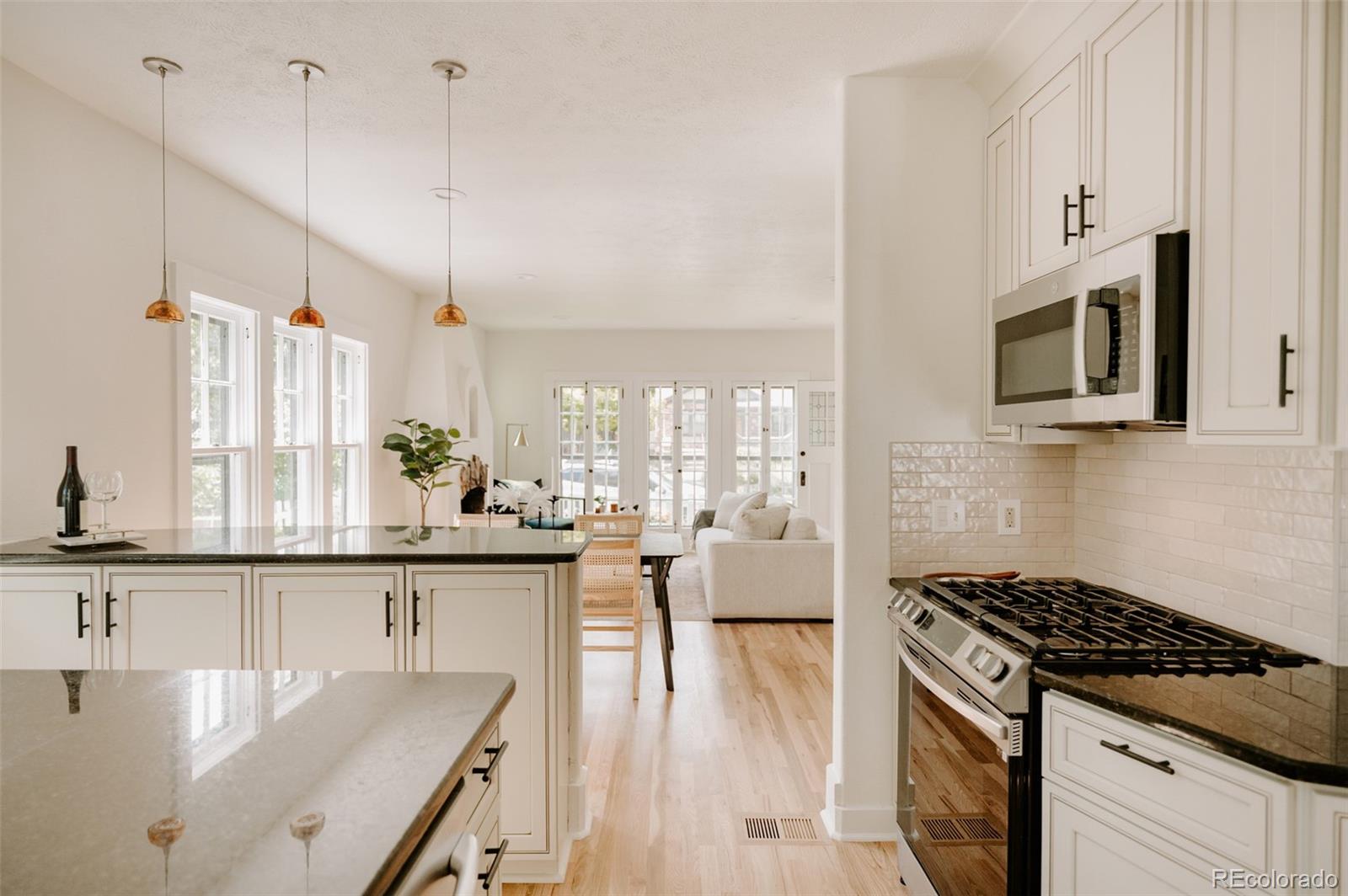 836 9th Street Boulder, CO 80302 - Photo 12 of 32 a kitchen with stainless steel appliances granite countertop a stove a sink and a refrigerator