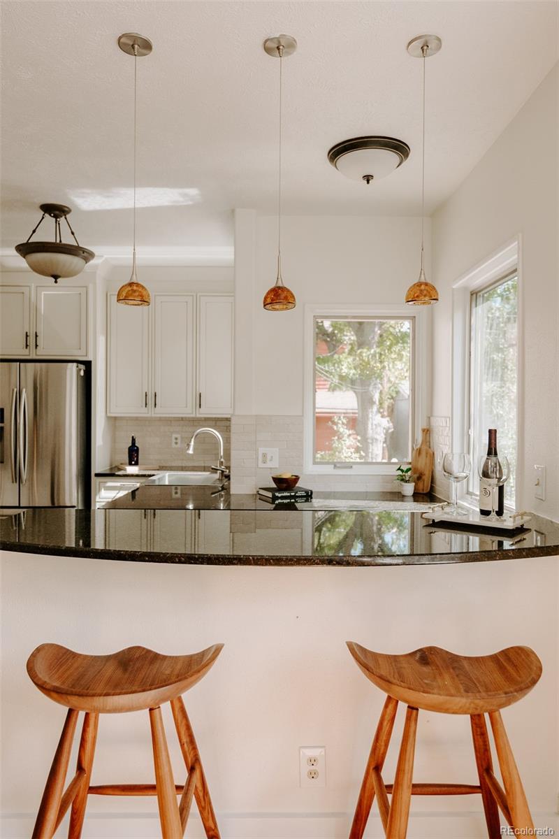 836 9th Street Boulder, CO 80302 - Photo 13 of 32 a view of kitchen island with furniture and windows