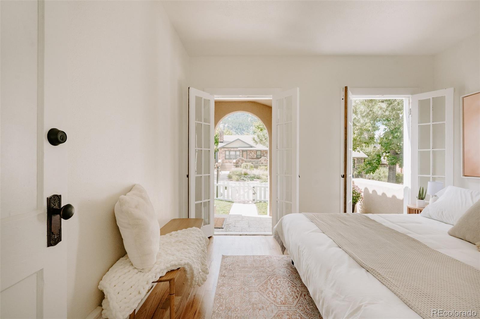 836 9th Street Boulder, CO 80302 - Photo 16 of 32 a bedroom with a bed and a large window