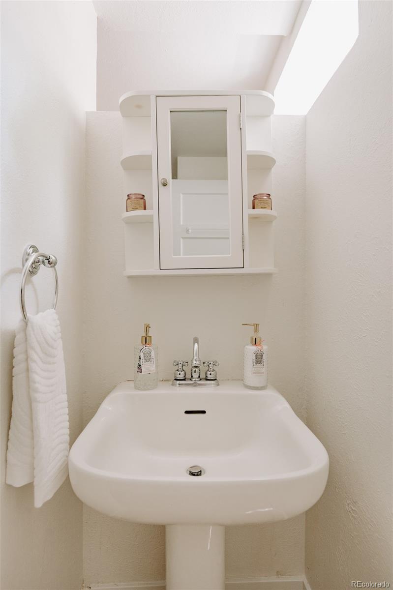 836 9th Street Boulder, CO 80302 - Photo 25 of 32 a bathroom with a sink and a mirror