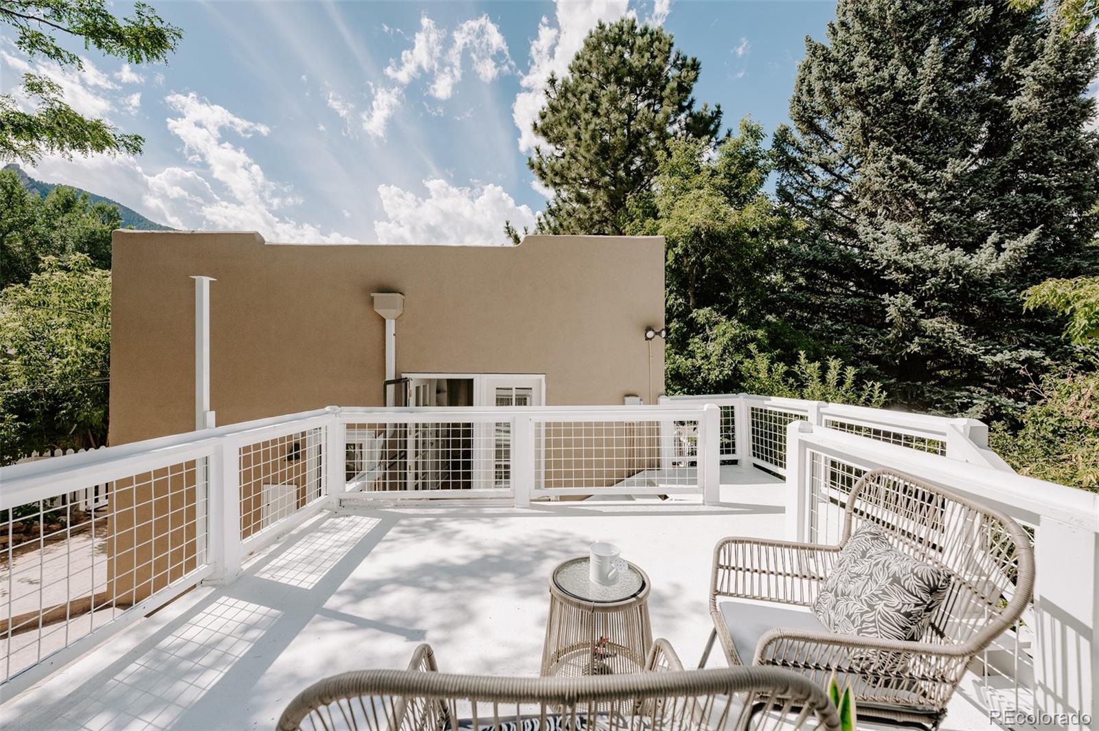 836 9th Street Boulder, CO 80302 - Photo 28 of 32 a balcony with table and chairs