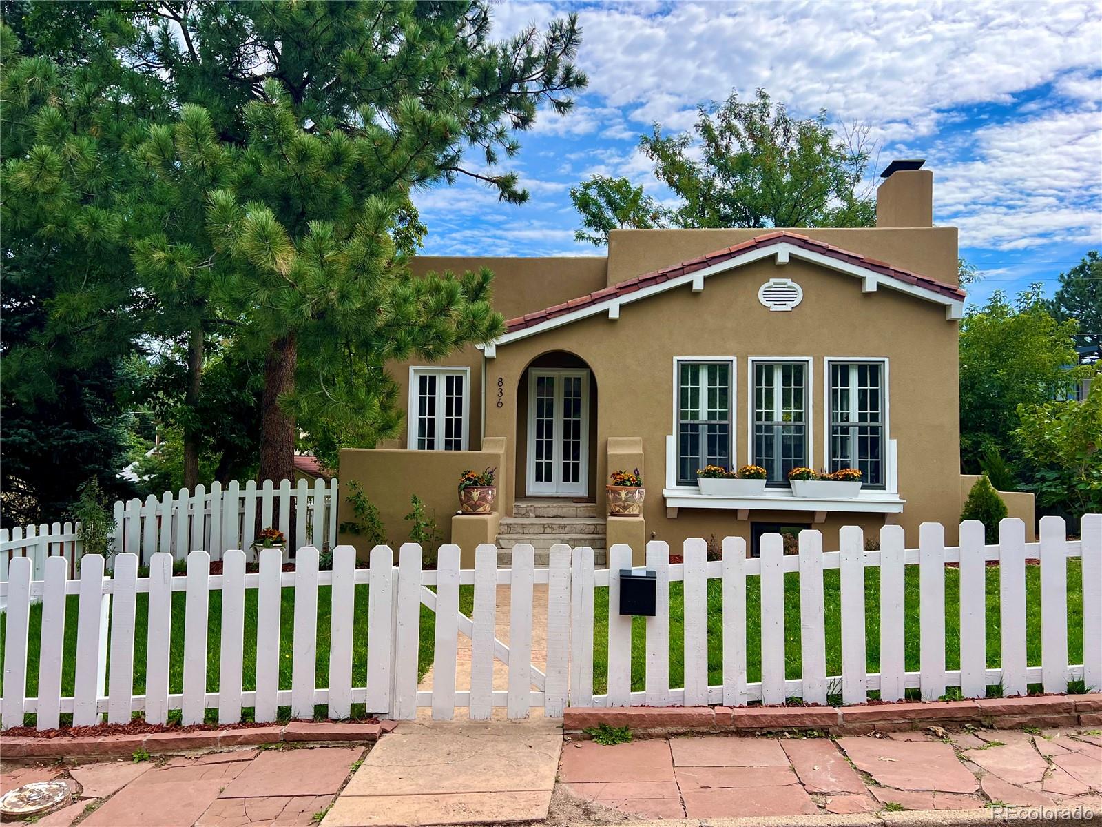 836 9th Street Boulder, CO 80302 - Photo 31 of 32 a front view of a house with a garden
