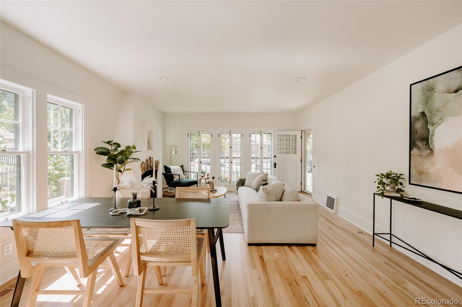 836 9th Street Boulder, CO 80302 - Photo 5 of 32 a living room with furniture floor to ceiling window and potted plant