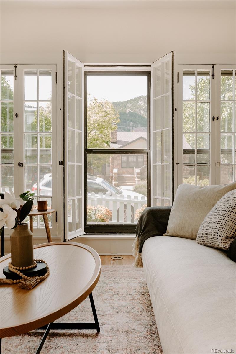 836 9th Street Boulder, CO 80302 - Photo 8 of 32 a living room with furniture and floor to ceiling window