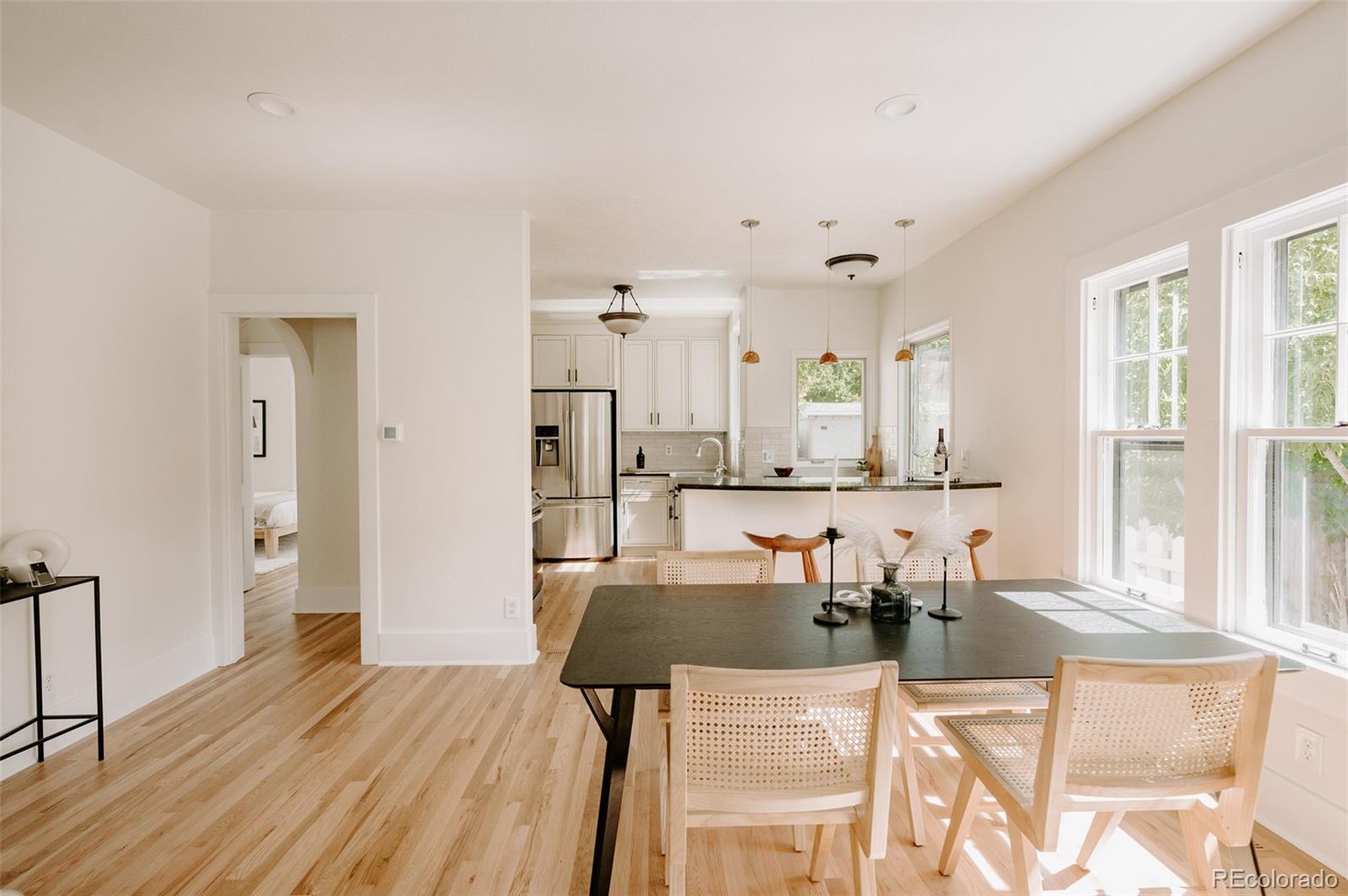 836 9th Street Boulder, CO 80302 - Photo 9 of 32 a view of a dining room with furniture and wooden floor