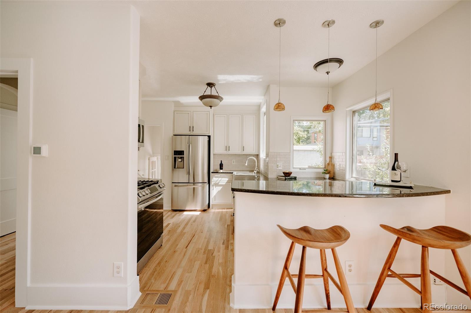 836 9th Street Boulder, CO 80302 - Photo 10 of 32 a large kitchen with a table and chairs in it