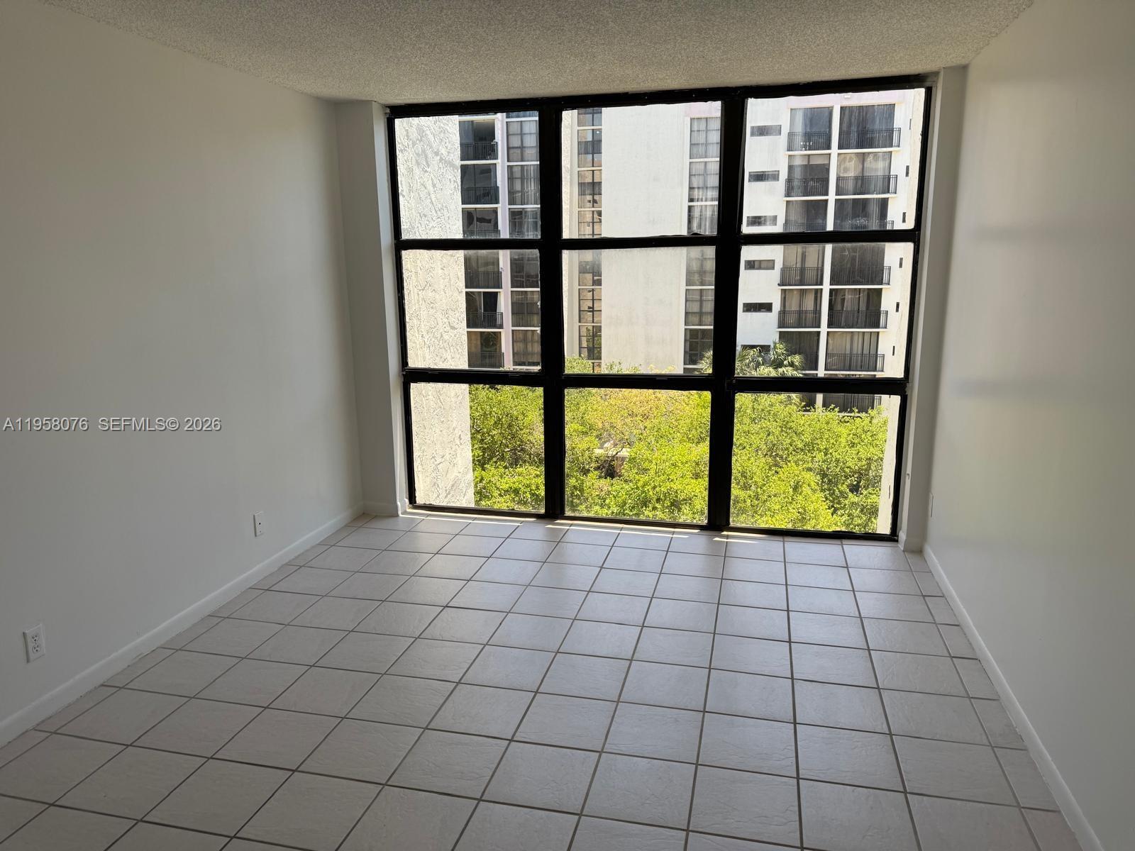 16919 North Bay Road, Unit 617 Sunny Isles Beach, FL 33160 - Photo 11 of 37 a view of an empty room with a window