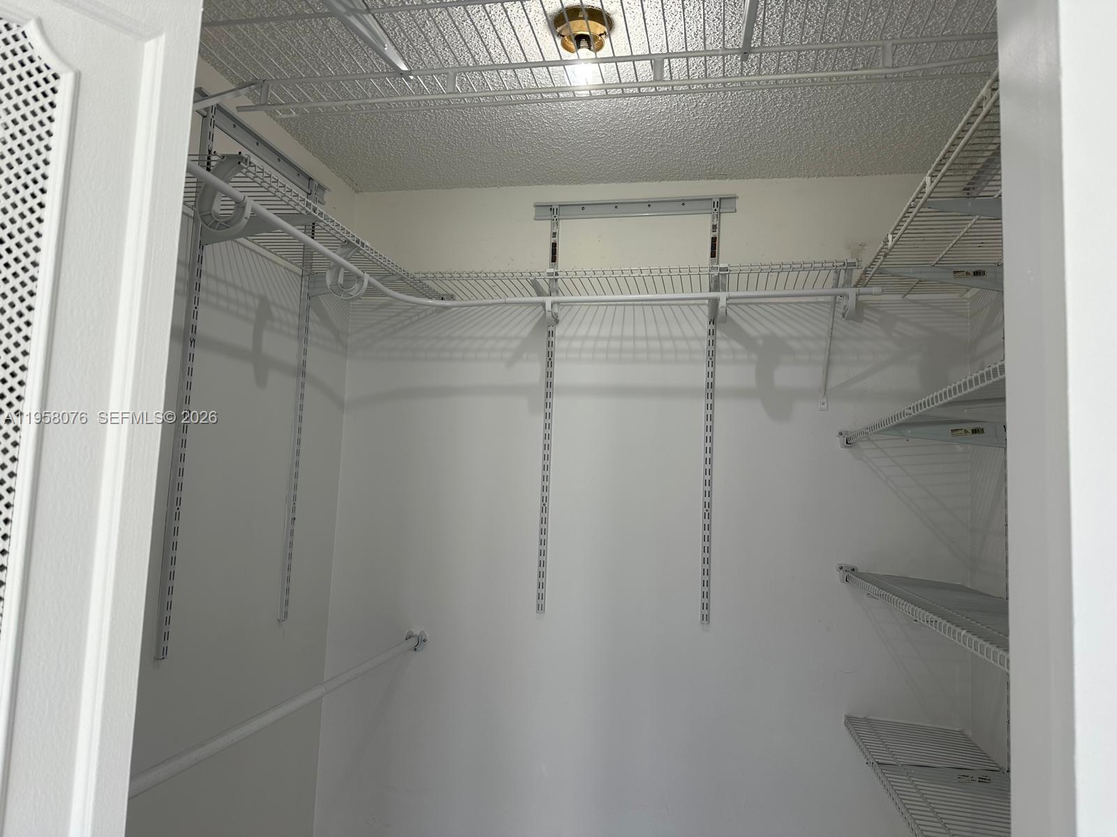 16919 North Bay Road, Unit 617 Sunny Isles Beach, FL 33160 - Photo 16 of 37 a view of a room with racks on the wall