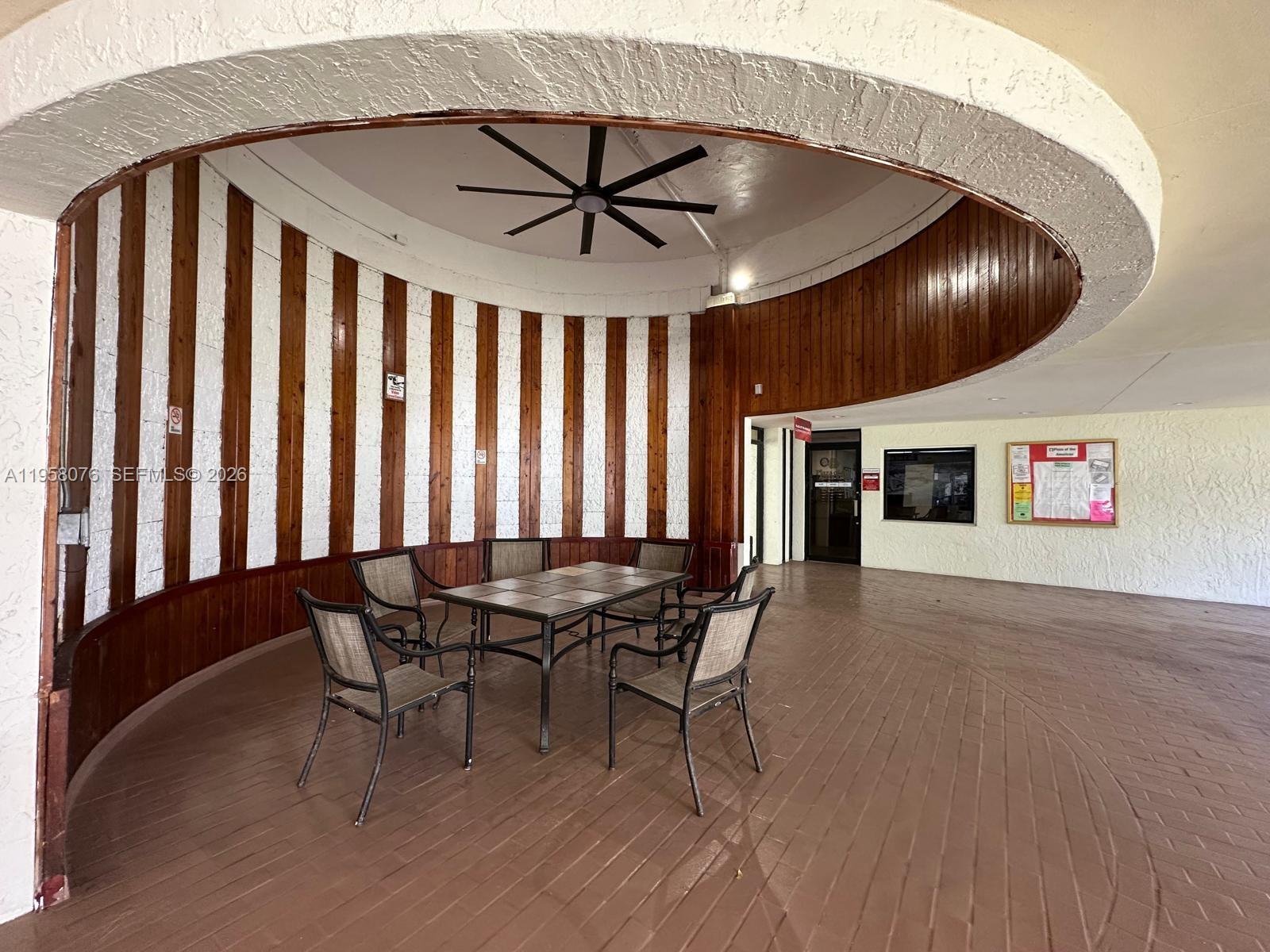 16919 North Bay Road, Unit 617 Sunny Isles Beach, FL 33160 - Photo 30 of 37 a dinning room with furniture and window