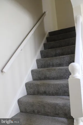 an empty room with wooden floor