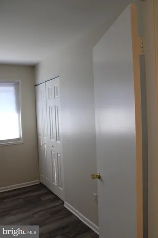 a white toilet sitting next to a bath tub and a shower