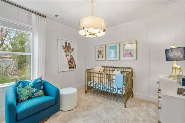 a bedroom with furniture and a window