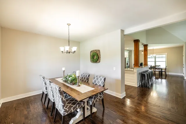 a kitchen with granite countertop white cabinets and sink