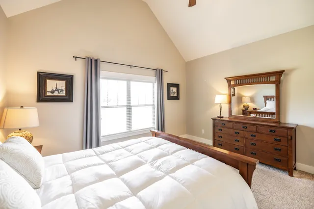 a kitchen with stainless steel appliances granite countertop sink stove and refrigerator