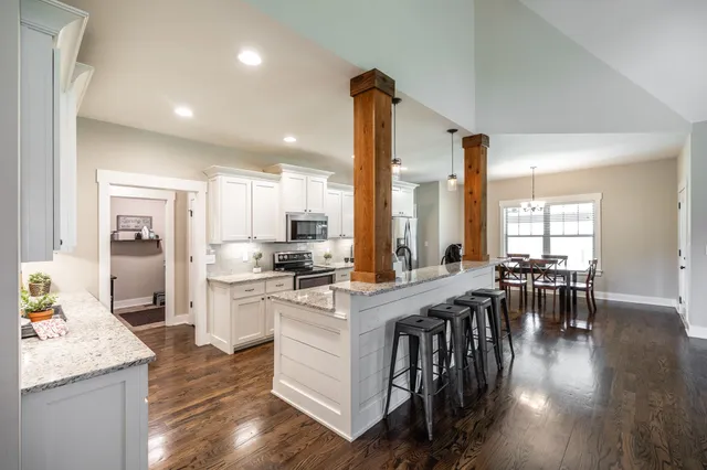 a kitchen with stainless steel appliances granite countertop a stove and a sink