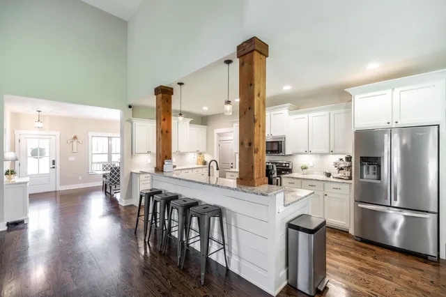 a living room with furniture and a table