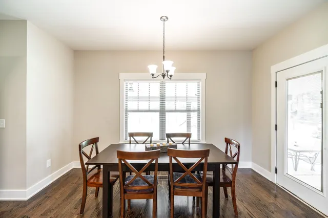 a large bed sitting in a bedroom next to a window