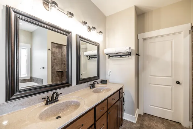 a balcony with couple of chairs and a window