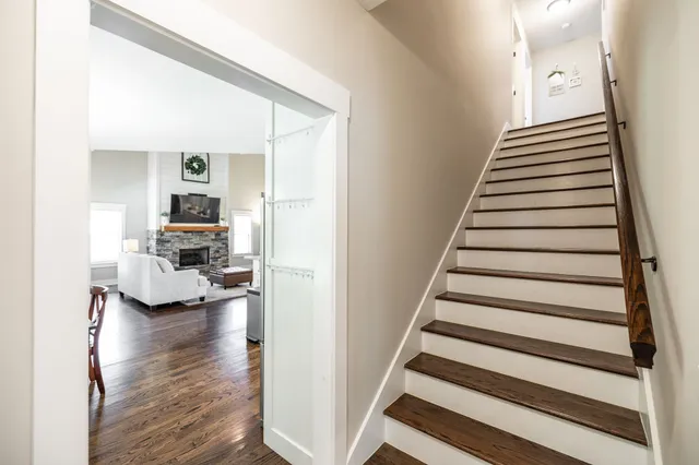 a front view of a house with a garden and yard