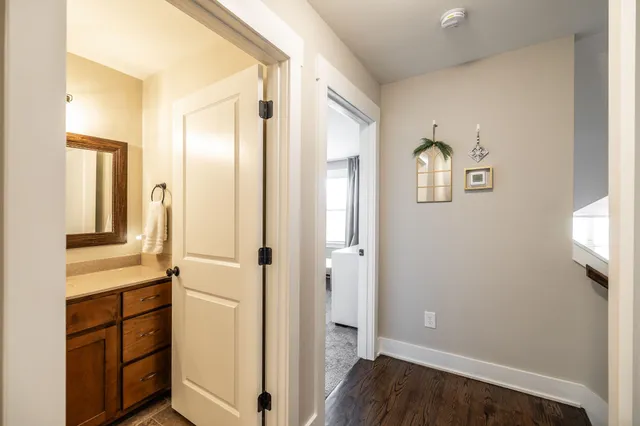 a front view of a house with a garden and plants