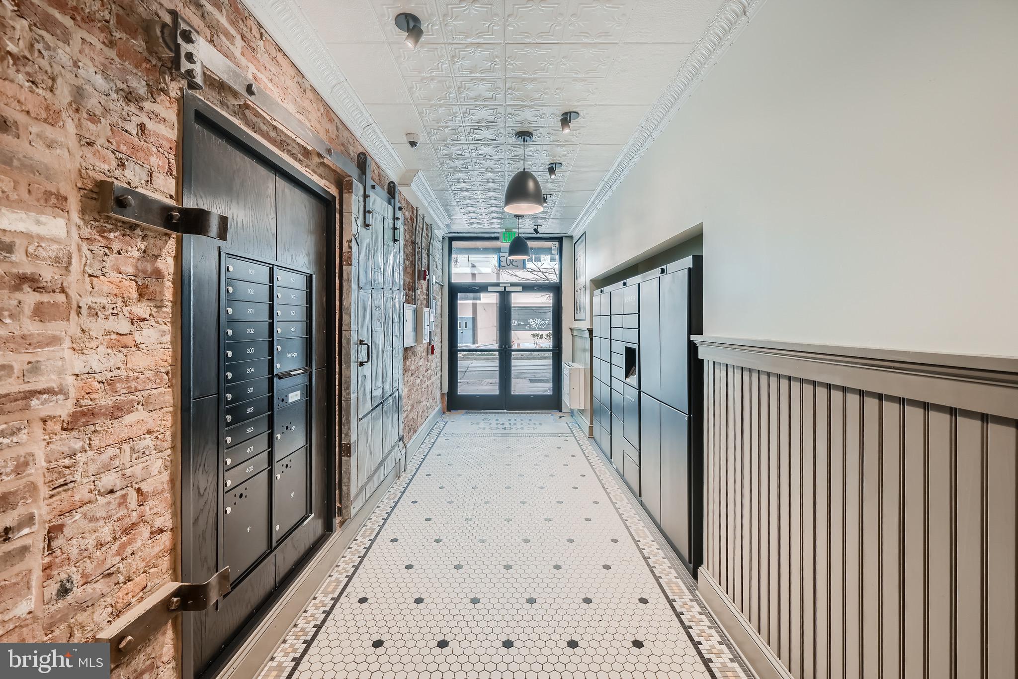 303 North Howard Street, Unit 601 Baltimore, MD 21201 - Photo 6 of 18 a view of hallway with chandelier