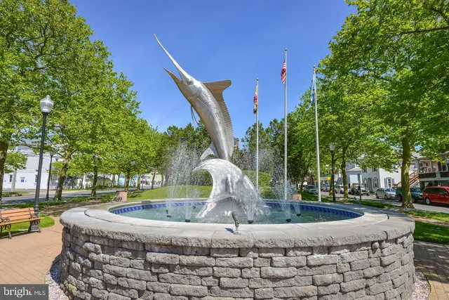 a front view of a building with swimming pool
