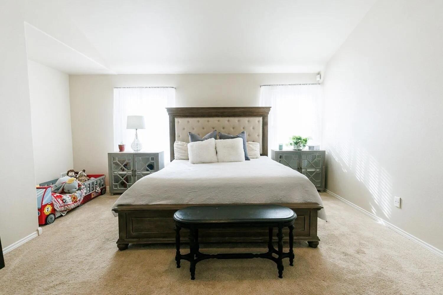 10602 Clinton Avenue Lubbock, TX 79424 - Photo 20 of 36 a bedroom with a bed and a window