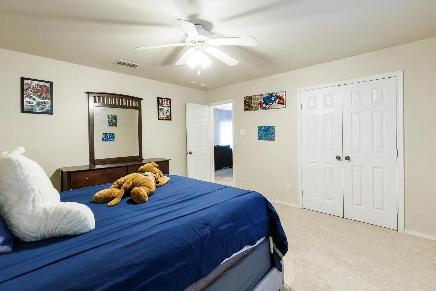10602 Clinton Avenue Lubbock, TX 79424 - Photo 30 of 36 a bedroom with a bed and furniture