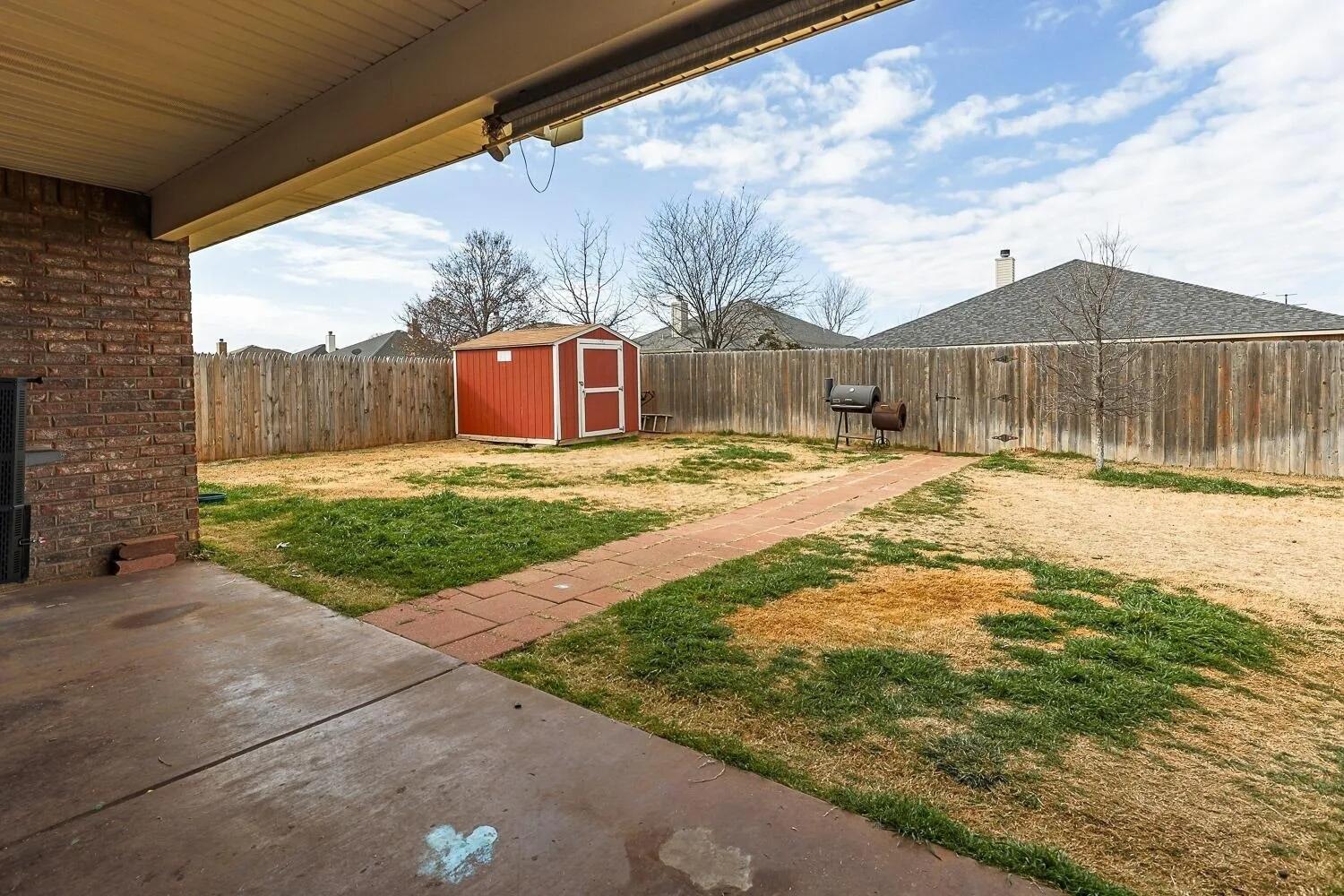 10602 Clinton Avenue Lubbock, TX 79424 - Photo 32 of 36 a view of a house with a yard