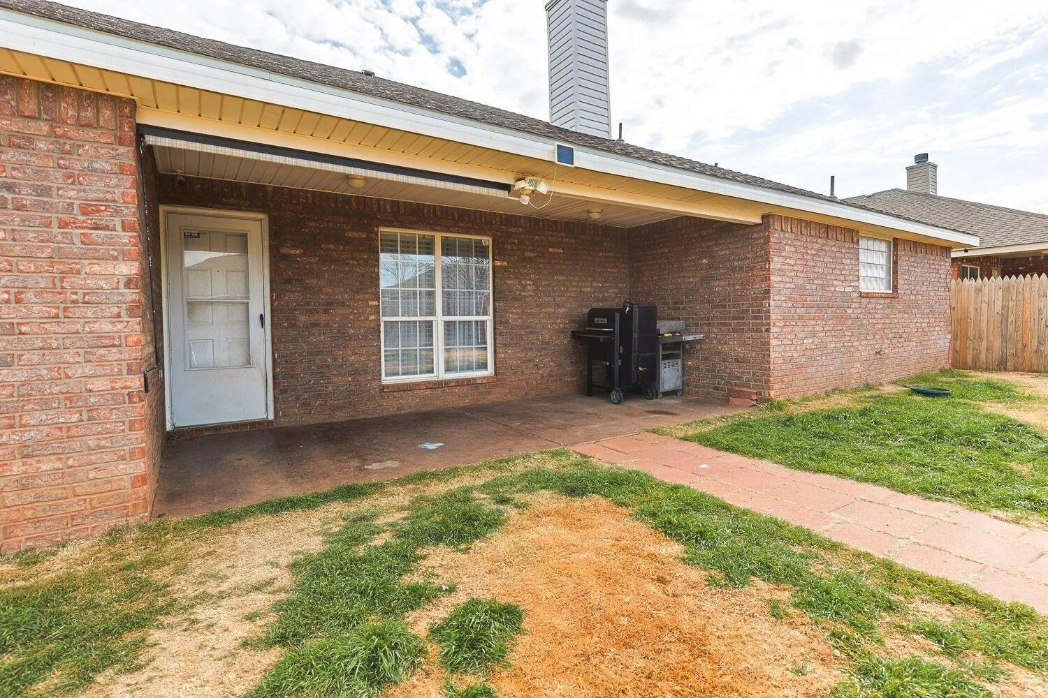 10602 Clinton Avenue Lubbock, TX 79424 - Photo 33 of 36 a view of a house with a yard