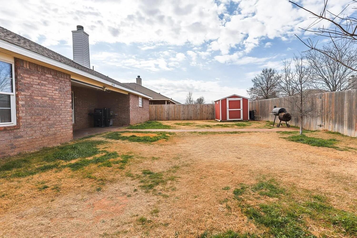 10602 Clinton Avenue Lubbock, TX 79424 - Photo 35 of 36 a view of a house with a yard