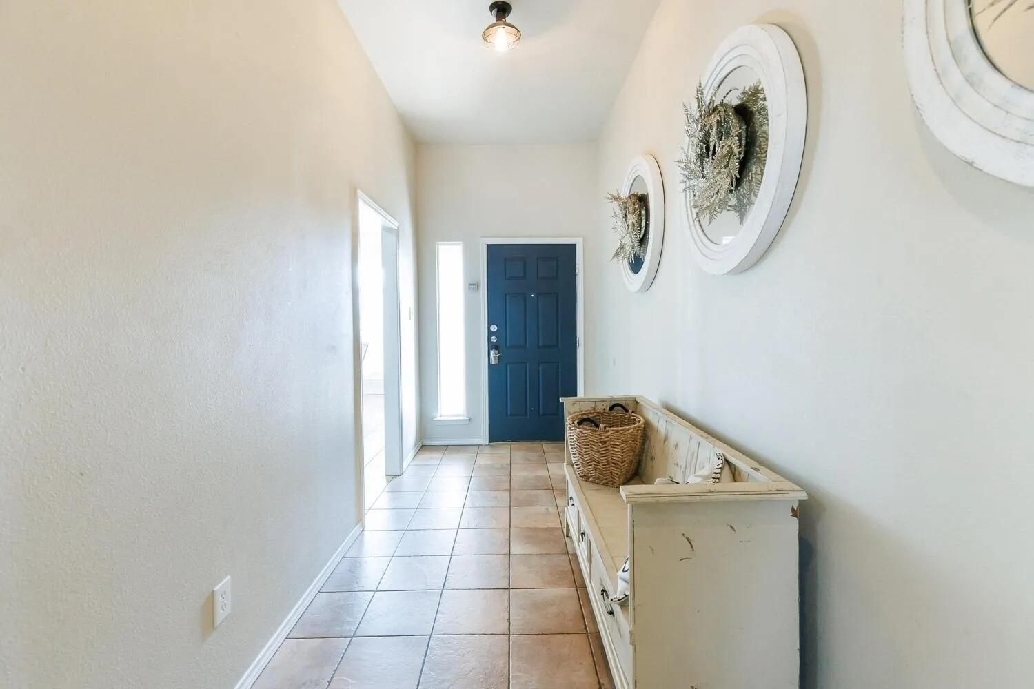 10602 Clinton Avenue Lubbock, TX 79424 - Photo 5 of 36 a utility room with dryer and washer