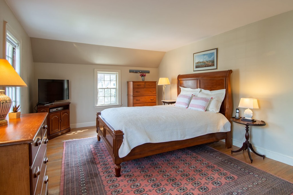 42 Earle Road Wellesley, MA 02481 - Photo 12 of 18 a bedroom with a bed and a flat screen tv