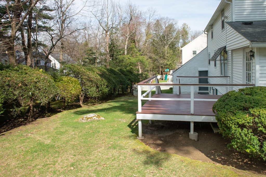 42 Earle Road Wellesley, MA 02481 - Photo 18 of 18 a view of a chairs setting in the backyard of a house