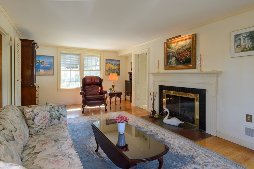 42 Earle Road Wellesley, MA 02481 - Photo 6 of 18 a living room with furniture and a fireplace