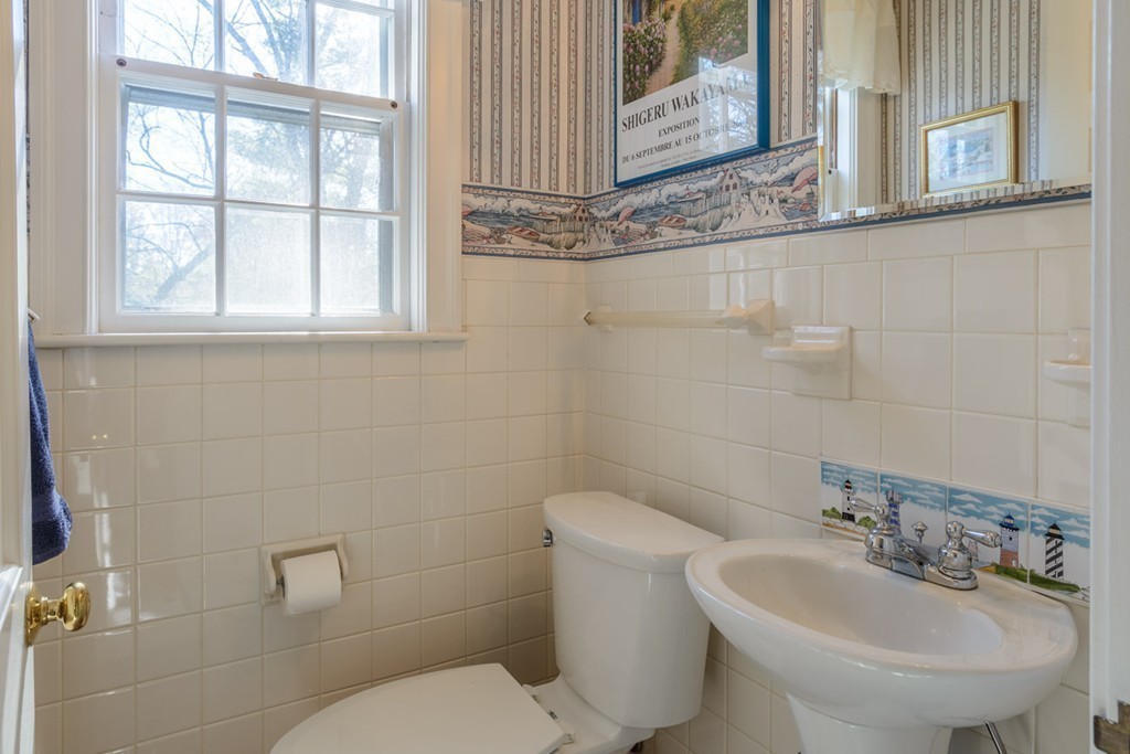 42 Earle Road Wellesley, MA 02481 - Photo 10 of 18 a bathroom with a toilet sink and mirror