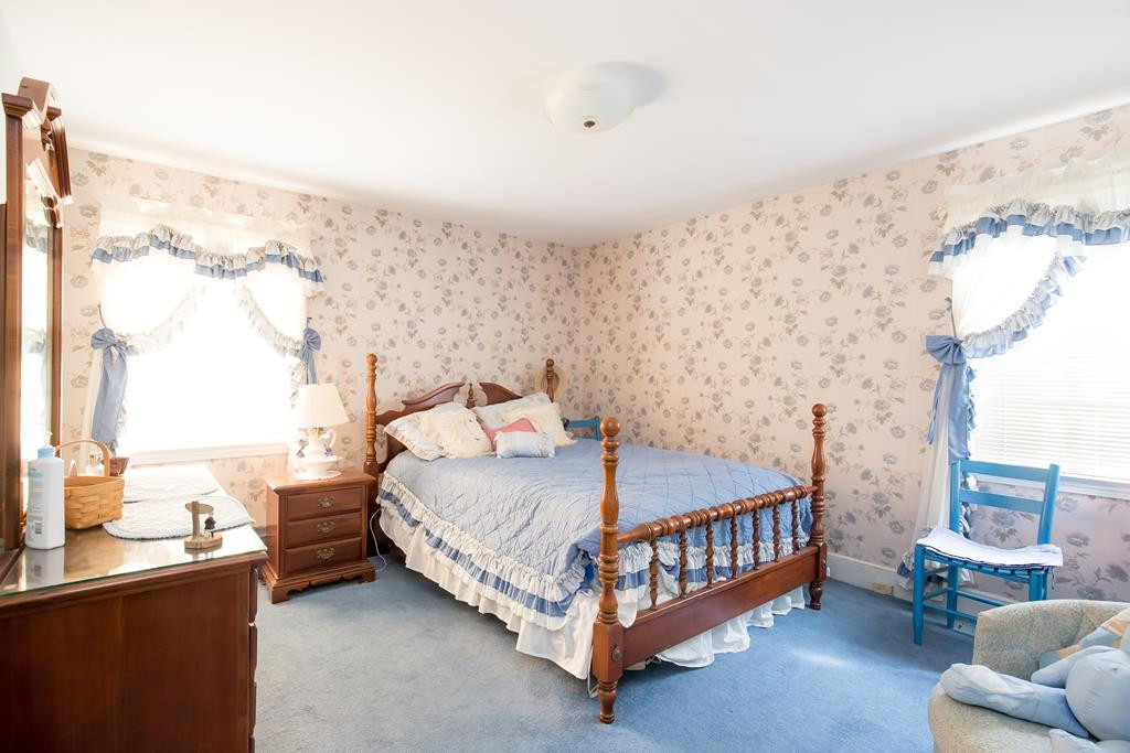 499 Pine Street Bamberg, SC 29003 - Photo 7 of 28 a bed sitting in a bedroom next to a window