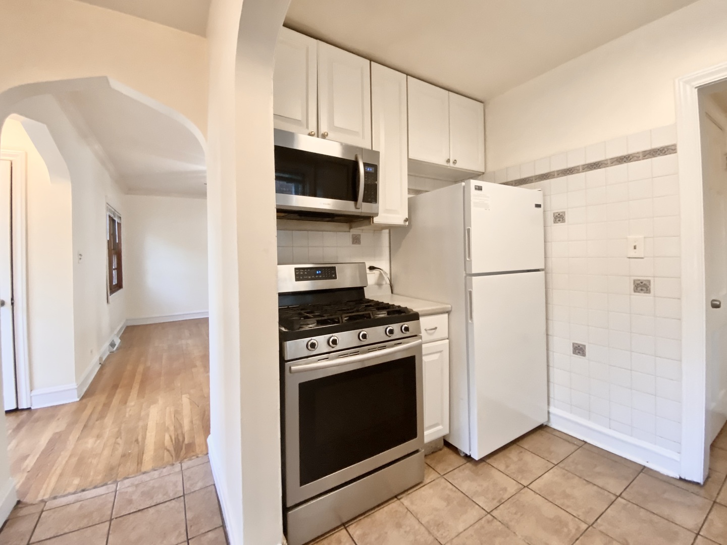 18034 Ridgewood Avenue Lansing, IL 60438 - Photo 17 of 35 a kitchen with a stove a refrigerator and a sink