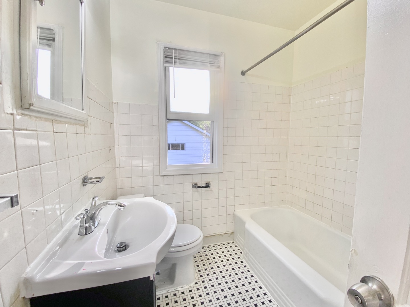 18034 Ridgewood Avenue Lansing, IL 60438 - Photo 21 of 35 a bathroom with a sink a toilet and bathtub