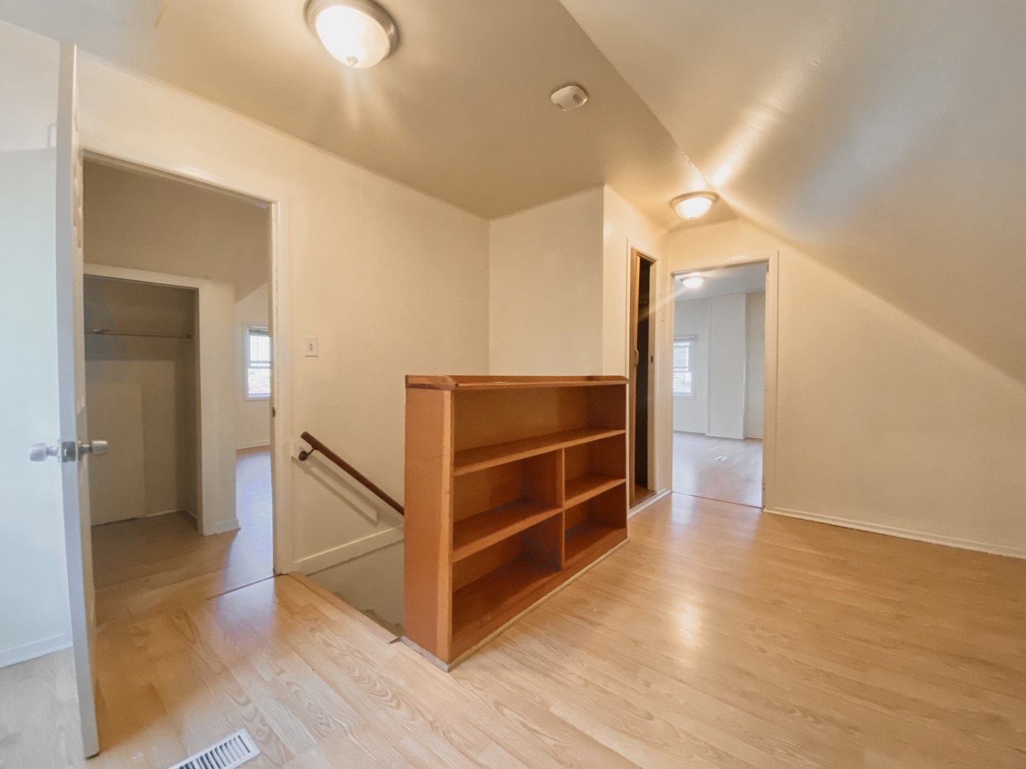 18034 Ridgewood Avenue Lansing, IL 60438 - Photo 23 of 35 a view of a hallway with wooden floor and stairs