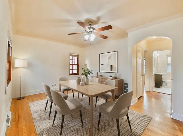 a view of a dining room with furniture and wooden floor