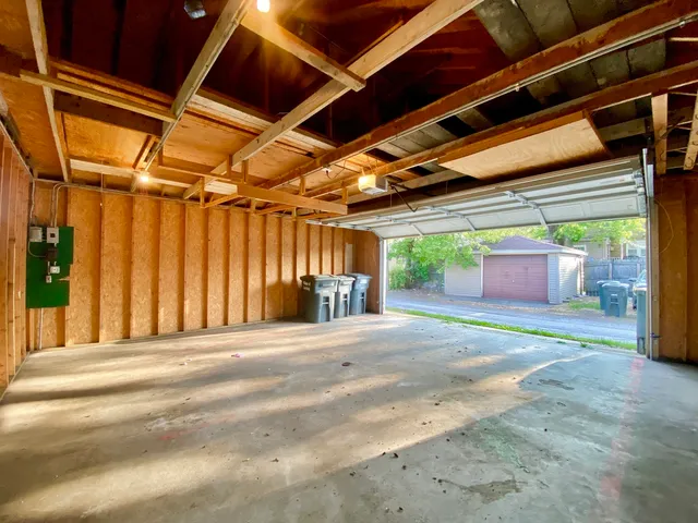 a view of a house with a porch and garage