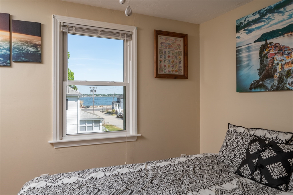 29 Wituwamat Road Weymouth, MA 02191 - Photo 31 of 42 a bedroom with a bed and a window