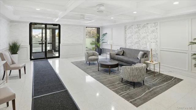 a living room with furniture rug and window