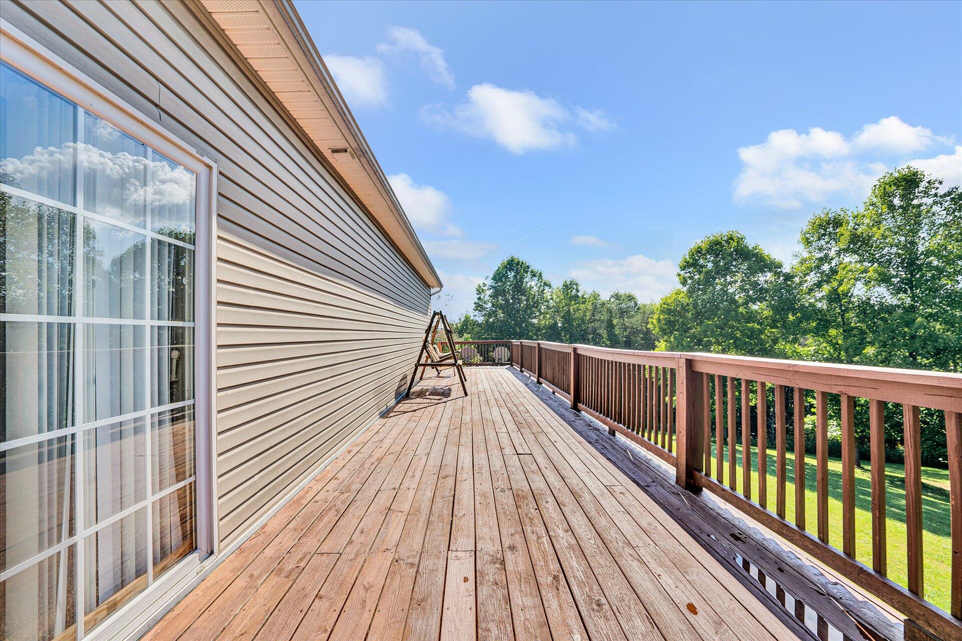 1081 Wooldridge Road Blue Ridge, VA 24064 - Photo 14 of 38 a view of balcony with wooden floor and fence