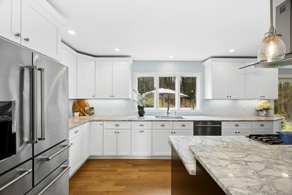 97 Willow Brook Road Holden, MA 01520 - Photo 12 of 42 a kitchen with a sink refrigerator and cabinets