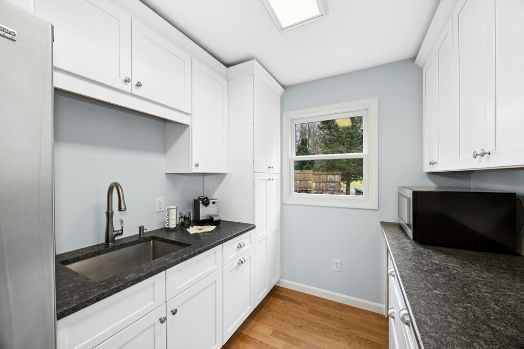 97 Willow Brook Road Holden, MA 01520 - Photo 15 of 42 a kitchen with granite countertop a sink cabinets and window
