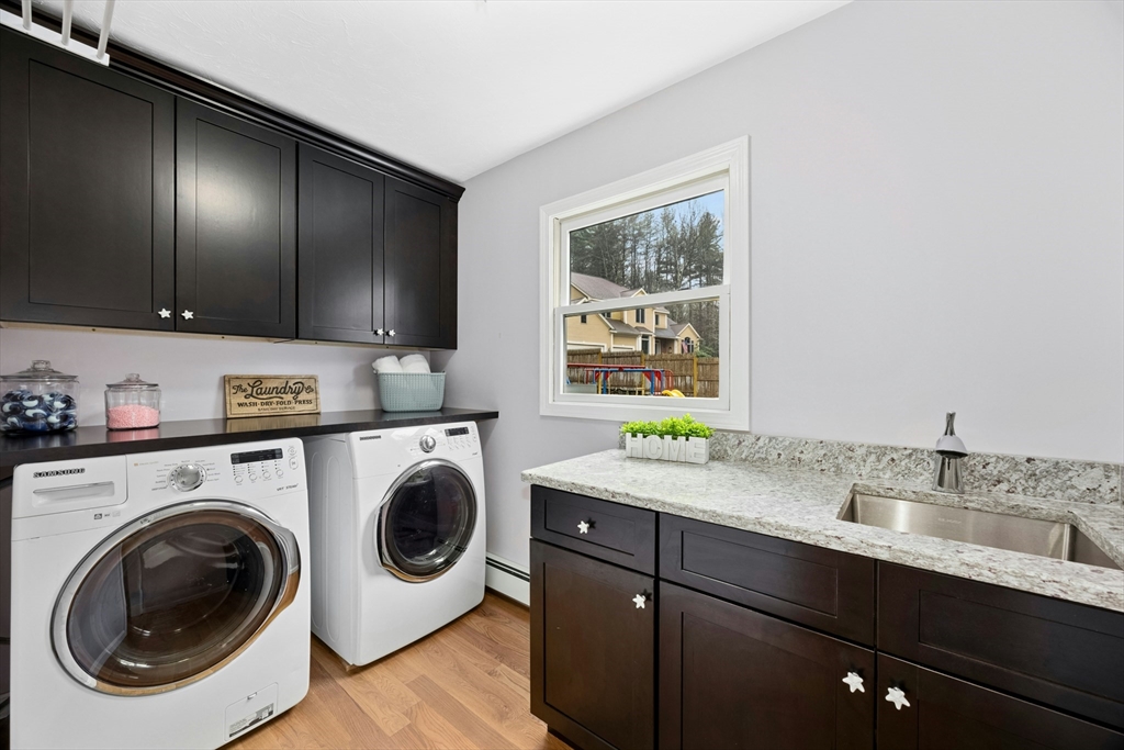 97 Willow Brook Road Holden, MA 01520 - Photo 16 of 42 a utility room with sink dryer and washer