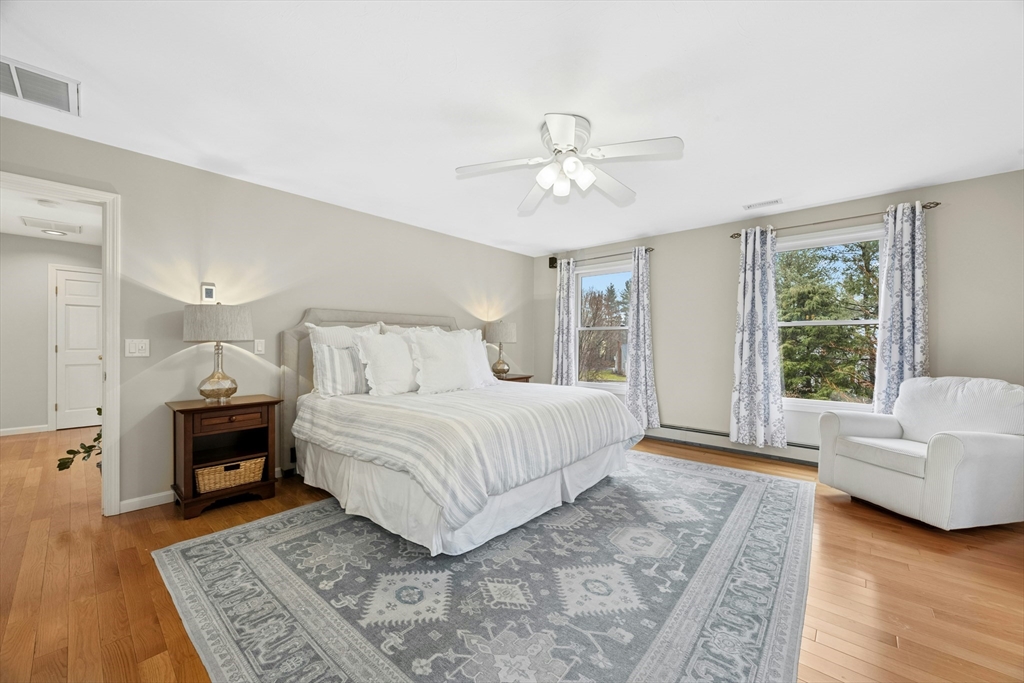 97 Willow Brook Road Holden, MA 01520 - Photo 22 of 42 a bedroom with a large bed and a couch